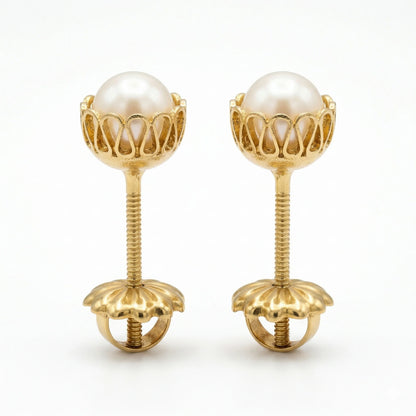 Vista de perfil de Aros de Oro 18k para niña con tornillo de seguridad con tope y rosca protectora.
